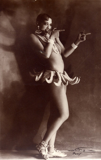 Sepia tint photo of African-American performer Josephine Baker wearing her famous skirt of bananas.