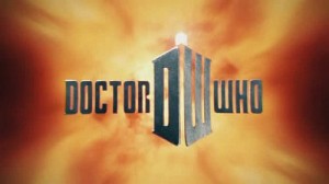 Dr Who series 5 title card - on a cloudy orange background the show's title is picked out in metallic-look sci-fi style lettering. In the centre of the screen the letters DW are styled and perspectived to look like the box-shape of the Doctor's ship, the TARDIS. Image via Wikipedia, shared under Creative Commons